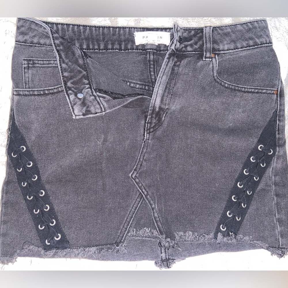 Pacsun black denim jean skirt with blacks laces on sides. Size 26.
